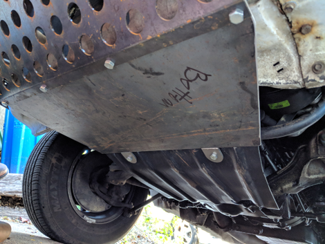 A close-up of where the new bumper ties in to the shielding under the car.
